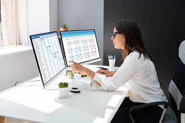 Employee Working On Calendar Schedule