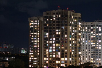Fototapeta na wymiar Lights of a colorful residential building in Kiev, Ukraine