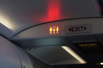 Occupied WC signs in a plane