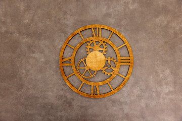 Wooden clock face with cogwheels on rusty grunge background - Time concept