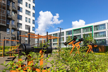 Workout place with gym equipment outdoors in the residential apartment district