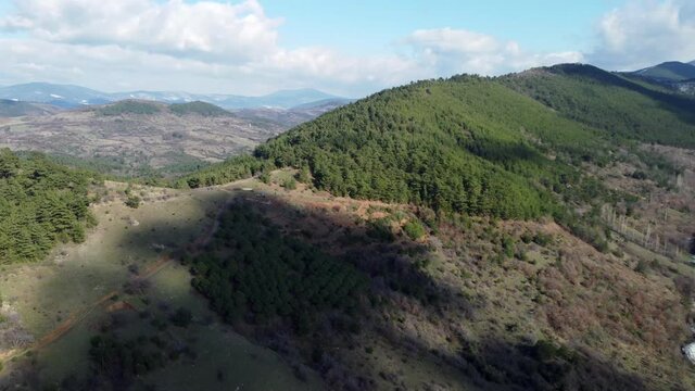 Aerial view of Snow between the hills at Canakkale Evciler village region and Mountain Kaz on the background.