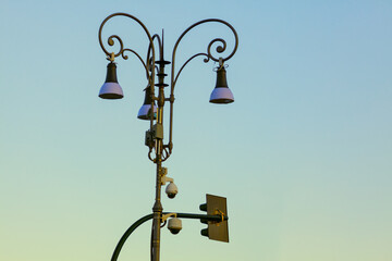 Figured forged street lights . Vintage street lamps and traffic lights