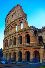 Obraz na płótnie Canvas Side view of Colosseum . Ancient architecture in Rome Italy . Antique architectural arches