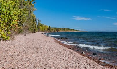 Stony beach landscape on the north shore of Lake Superior in Minnesota. This Great Lake is called...