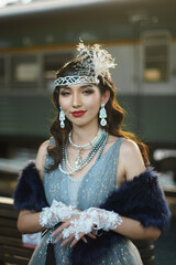 Retro vintage portrait of beautiful Gatsby woman stand look around, wait coming train for lover