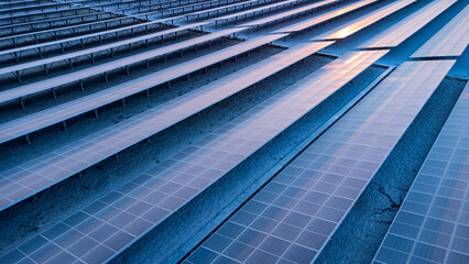 Top view of solar panels (solar cell) in solar farm and sun lighting reflect with copy space .Photovoltaic power plant field for power generation. Concept of global warming and climate change. 