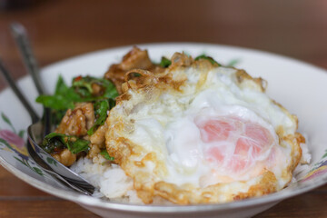 Rice topped with stir-fried pork and basil