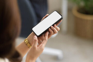 Close-up image of a female using smartphone.