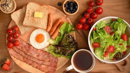 Healthy breakfast meal with salad bowl, black coffee. top view
