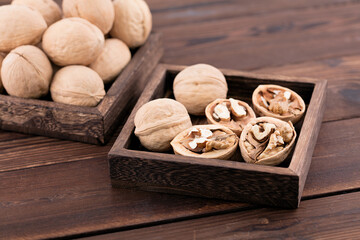 Dried walnuts are in a wooden box