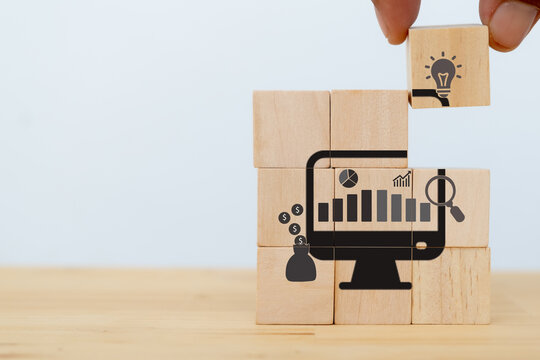 Data driven marketing concept.  Dats analysis for business strategy and marketing plan. Big data. Data mining. Businessman put the wooden cubes with data driven icon on white background and copy space