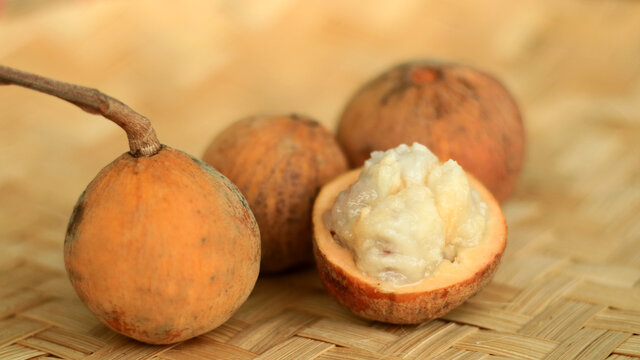 Wild mangosteen fruit or kecapi on woven bamboo.