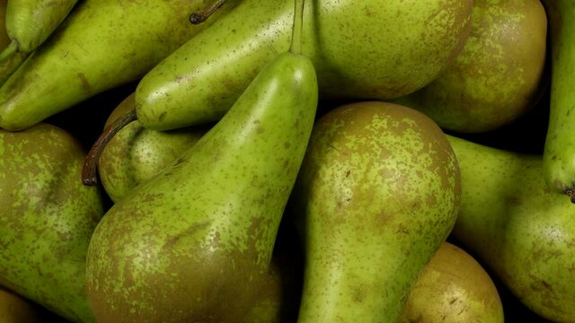 Fresh green pears rotation background. Close up