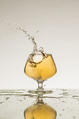 splash in glass cognac