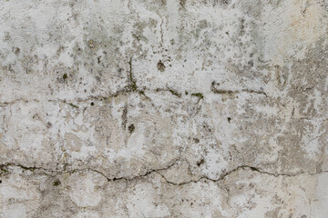 The antique wall is paved with gray stones, top view. stone texture, outdoor stone tiles