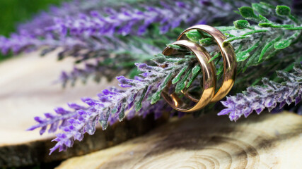 Wedding rings so close and a bouquet of lavender
