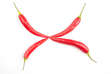 Red hot chili peppers on a white background. Vitamin vegetable food