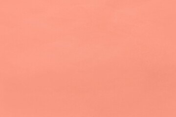 Very soft red or pale red color plain solid coral tone on organic recycled paper minimal texture background