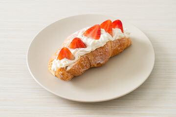 strawberry fresh cream croissant on plate
