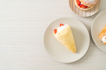 fresh strawberry cream crepe on plate
