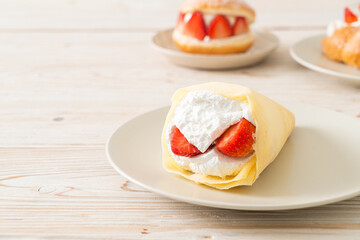 fresh strawberry cream crepe on plate