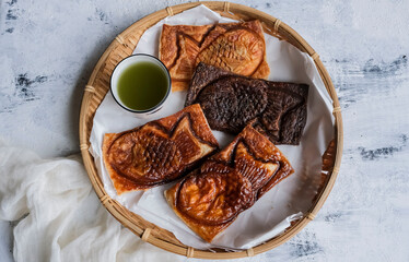 Homemade Japanese sweetened pastries. Taiyaki Croissant Matcha Roll and Matcha Tea. Choice of red...