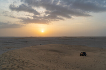 Singing Sand Dune in Qatar during sunset.