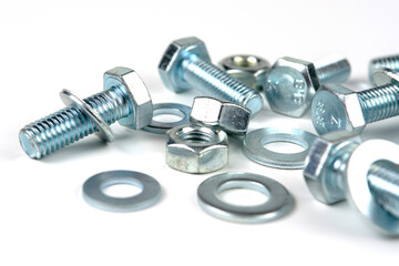 metal bolts and nuts with round washers close-up on a white background