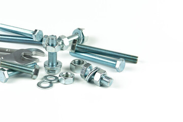 New repair tool, bolts and nuts close-up on a white background. Tool for connecting a threaded connection by tightening bolt nuts