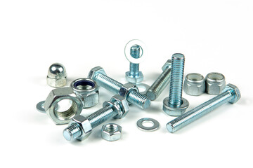 metal bolts and nuts with round washers close-up on a white background