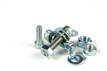 metal bolts and nuts with round washers close-up on a white background