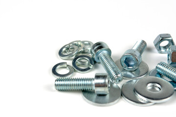 metal bolts and nuts with round washers close-up on a white background. copy space