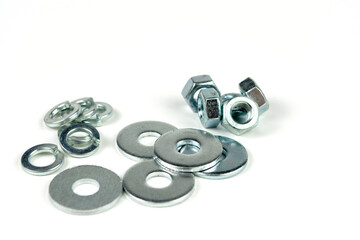 metal bolts and nuts with round washers close-up on a white background