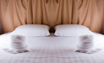 Fototapeta na wymiar Two pillows on white bed