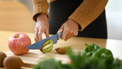 Young woman preparing healthy food in kitchen. Healthy food concept.