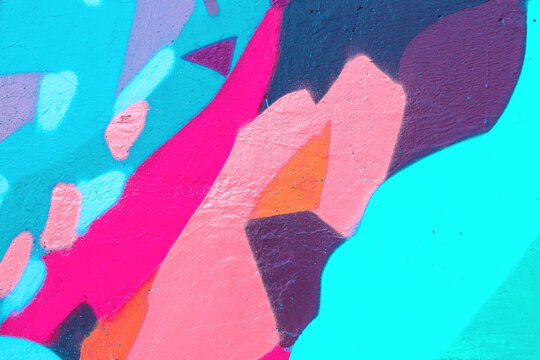 Closeup of colorful teal, pink and purple urban wall texture. Modern pattern for wallpaper design. Creative modern urban city background for advertising mockups. Minimal geometric style, solid colors