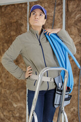 a woman fixing the ceiling