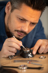 close up of watchmaker repair mechanical watch