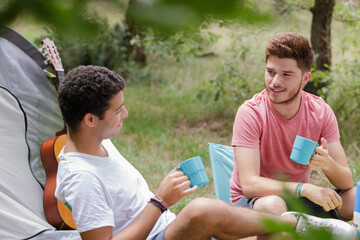 men in the campsite talking