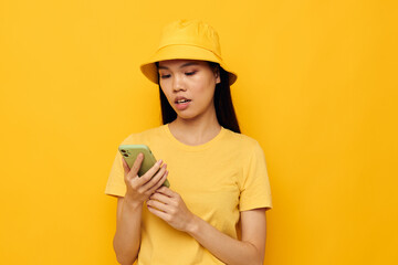 Portrait Asian beautiful young woman talking on the phone posing fashion isolated background unaltered