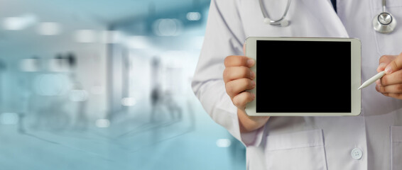 healthcare and medical doctor smart tablet device  doctor analyzing medical report at the hospital...