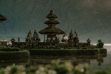 Fototapeta na wymiar View of the temple on Lake Beratan Bali, Indonesia on a sunny morning just after sunrise