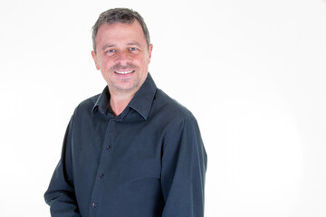 Cheerful older middle aged man standing smiling happy on white background