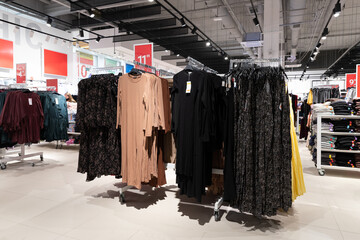 fashion store for women, evening dresses on a hanger, a wide selection of goods