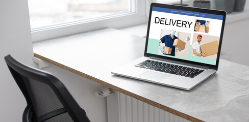 delivery icon on laptop keyboard. Online shopping, ecommerce and retail sale concept, delivery for customers ordering things from retailers websites using internet