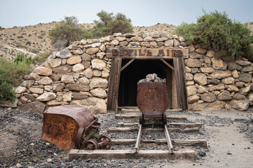 Rusty wagon in the old abandoned gold mine in the old west