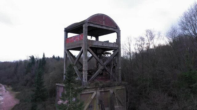 aerial shot of an abonded steel factory in a forest in normandy