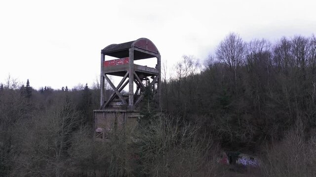 Aerial shot of an abonded steel factory in a forest in normandy