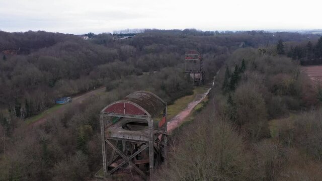 Drone shot of an abonded steel factory in a forest